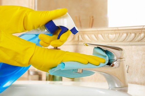 Deep cleaning a lounge sofa with specialist equipment